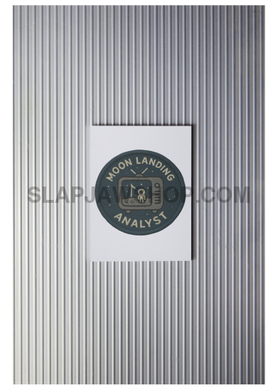 Metallic textured surface with a circular logo and text in the center