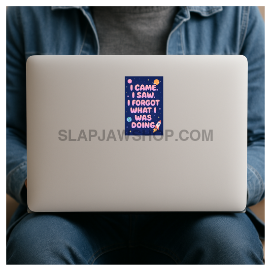 Person holding a laptop with a colorful sticker on the cover