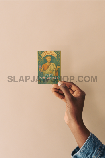 Hand placing a small vintage-style product packaging on a beige wall.