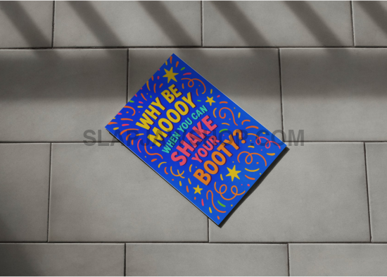 Colorful doormat with text on a gray tiled floor