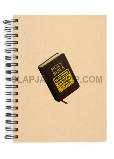 Notebook with a small book-shaped object on top on a white background