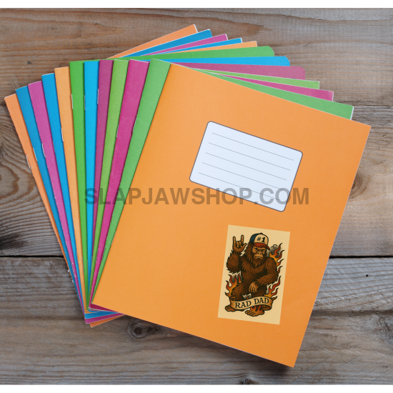 Set of colorful notebooks with a prominent orange one on a wooden surface