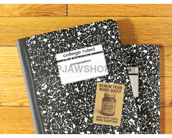 Two black composition notebooks with labels on a wooden surface
