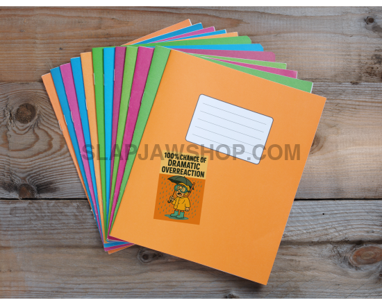 Stack of colorful notebooks on a wooden surface