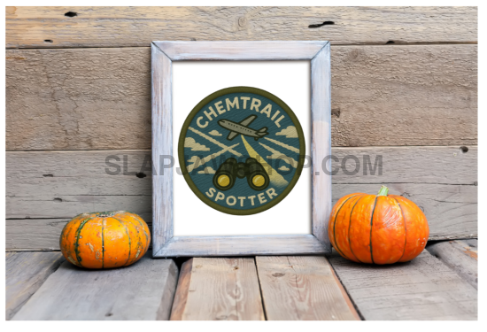 Framed picture of a green clock with pumpkins on a wooden surface