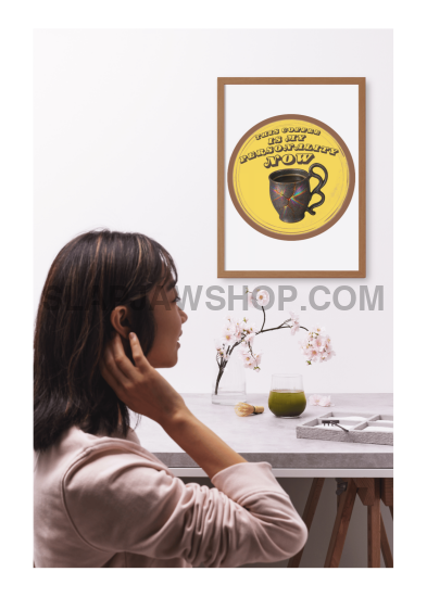 Woman talking on phone with framed artwork on wall