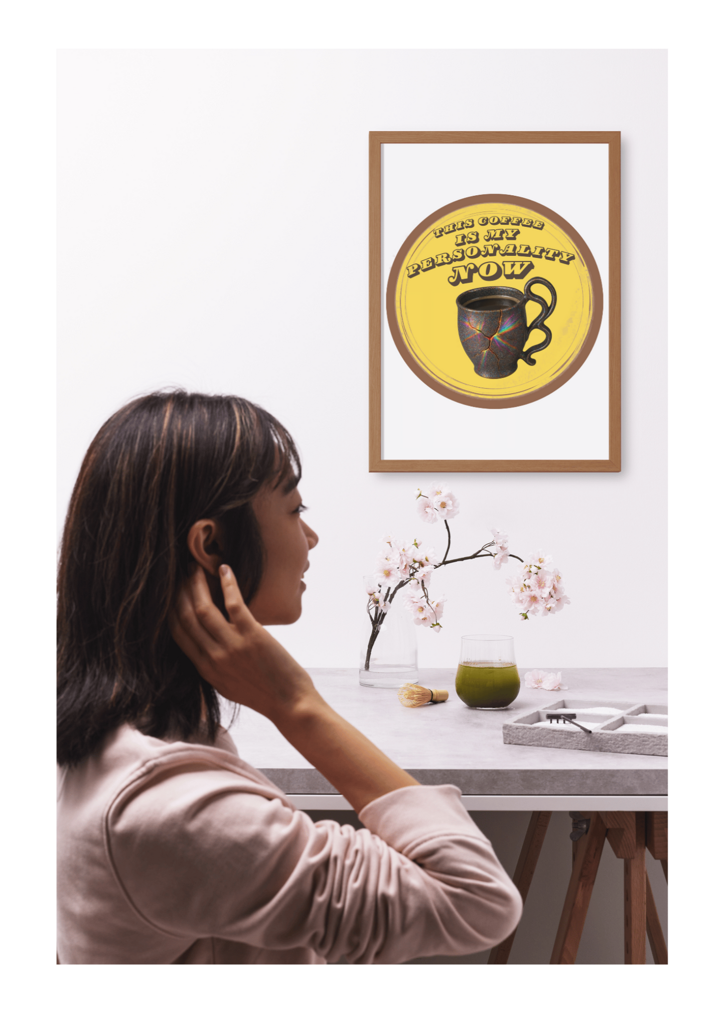 Woman talking on phone with framed artwork on wall