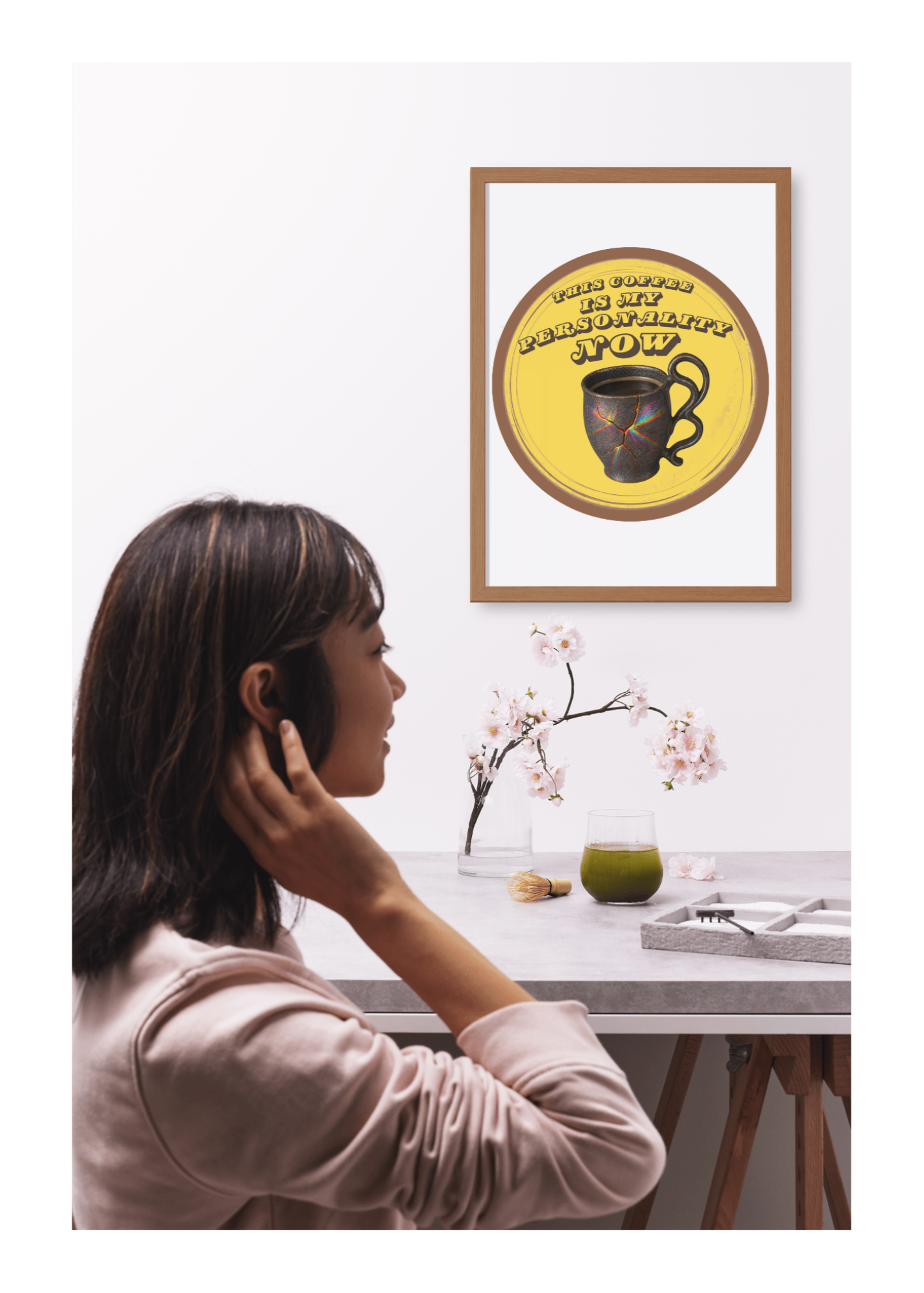 Woman talking on phone with framed artwork on wall