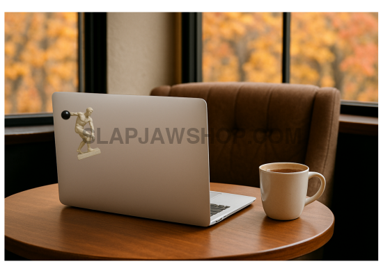 Laptop on a table with a cup of coffee, autumn foliage outside the window