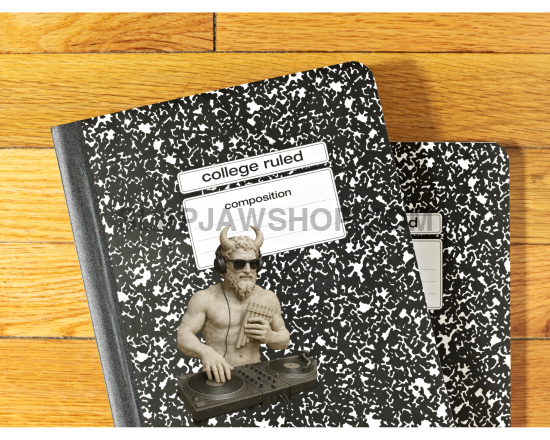 Two composition notebooks with a decorative cover on a wooden surface