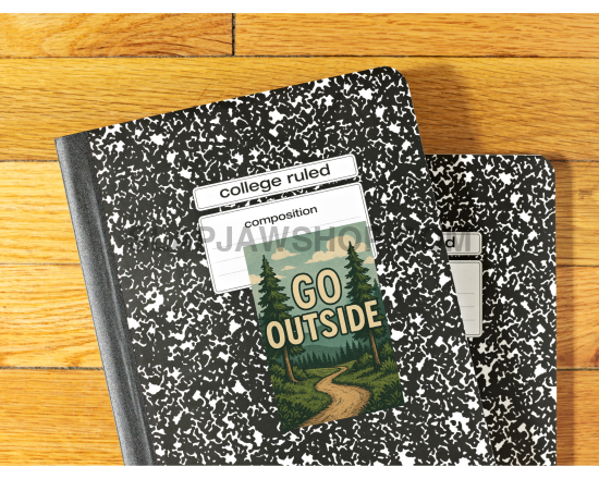 Two composition notebooks on a wooden surface with 'Go Outside' design.