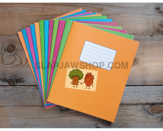 Set of colorful books on a wooden surface