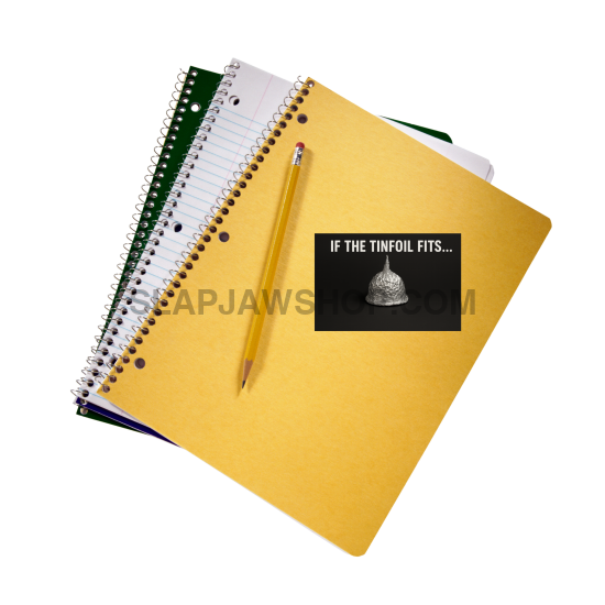 Yellow notebook, green spiral-bound book, and pencil on a white background with a humorous sticker.
