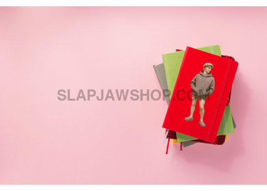 Stack of colorful notebooks on a pink background