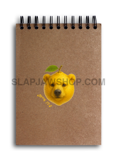 Brown notebook with a bear emoji on a white background