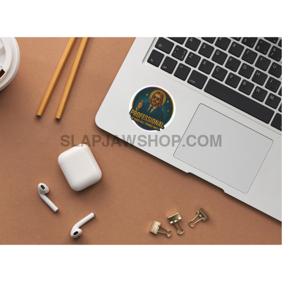 Laptop with a sticker, earbuds, and a coffee cup on a brown surface