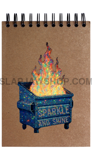 Notebook with a fire pit design and 'Sparkle and Shine' text on a white background