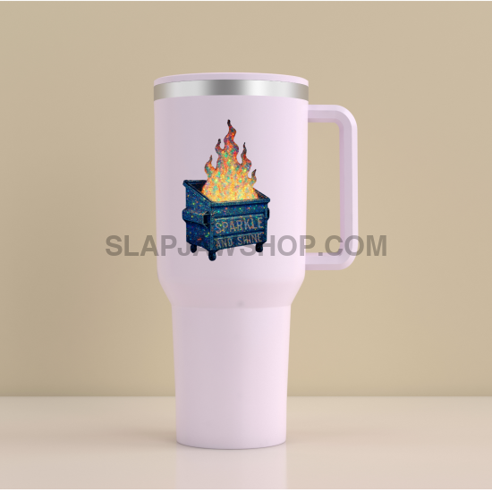 White travel mug with a design of a cake on fire and text on a beige background