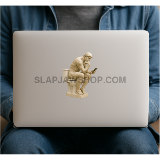Laptop with a sticker of a thinker sitting on a chair, held by a person wearing a denim jacket.