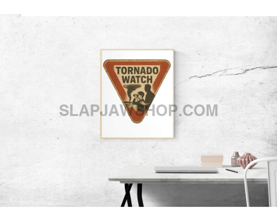 Framed artwork of a vintage-style 'Tornado Watch' sign on a white wall.