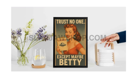 Person holding a laptop with a sticker on the cover