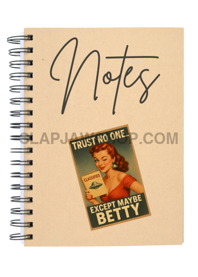 Notebook with a vintage-style cover and a small poster on a beige background