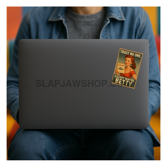 Person using a laptop with a sticker on the cover