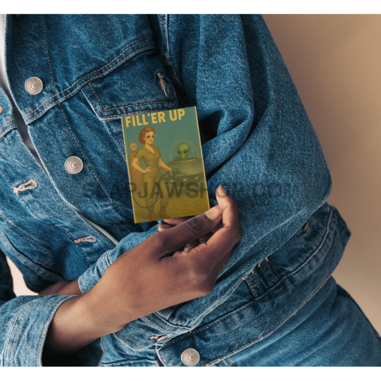 Person holding a book titled 'Filter Up' against a denim jacket.