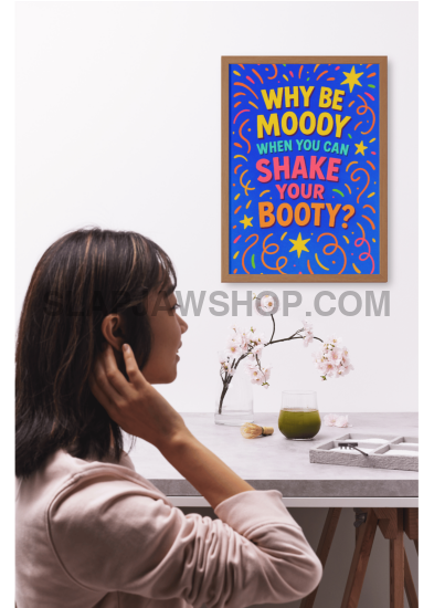 Person holding a laptop with a colorful sticker on the cover